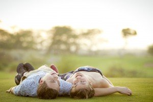 Couple laying in grass
