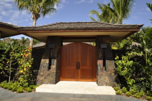 Front Gate of Home surrounded by Rock Wall