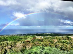rainbow over ocean in kona hawaii