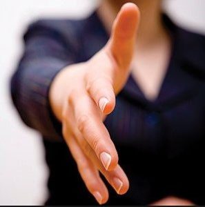 woman extending hand for handshake