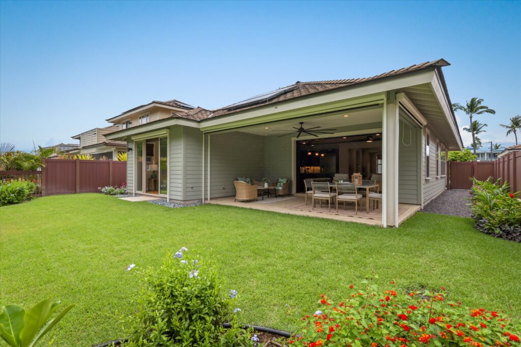 Lanai with golf course views at a Keauhou home in a gated community